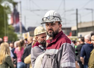 Steelworkers at a demonstration in front of the headquarters of ThyssenKrupp Steel Europe in