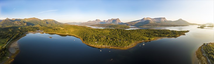 Panoramic aerial view over the fjord Efjord south of Narvik, seen at sunset, leisure boats anchor,