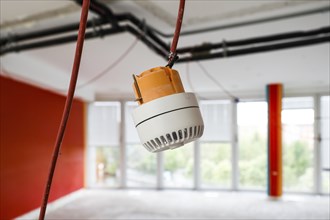 A smoke detector hanging on a wall for mounting, Berlin, 15/04/2024, Berlin, Berlin, Germany,