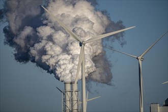 Chimneys, smoke plume of the RWE coal-fired power plant Eemshavencentrale, wind power plant, in the