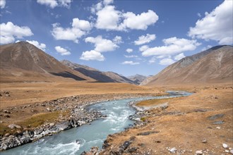 Burkhan valley with blue river, mountain landscape with golden meadows, Terskey Ala-Too, Tien Shan,