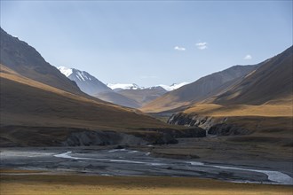 Burkhan valley with river, mountain landscape with golden meadows, Terskey Ala-Too, Tien Shan,