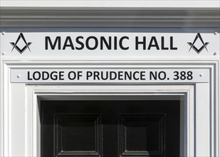 Sign above doorway entrance to Masonic Hall, Lodge of Prudence number 388, Halesworth, Suffolk,