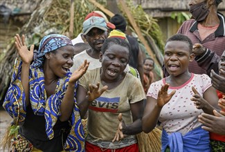 Pygmy woman of the BaAka people dancing and singing, Libongo, Est region, Cameroon, Africa