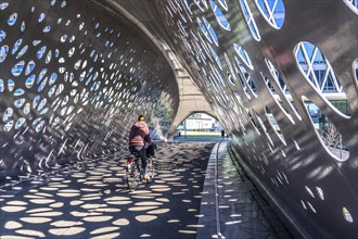 Light effects from the sun in the Parkbruk, a cycle and pedestrian bridge in the city centre of