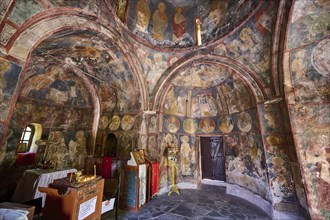 The interior of an old church with religious wall paintings, Byzantine chapel Agios Nikolaos