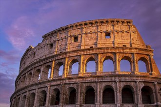 Famous Coliseum (Colosseum) of Rome at early sunset