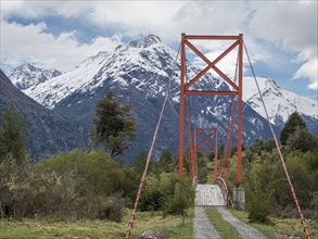 Old-style suspension bridge over river Rio Nadis south of Cochrane, Patagonia, Chile, South America