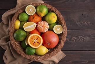 Assortment, citrus fruits, in a basket, close-up, top view, no people