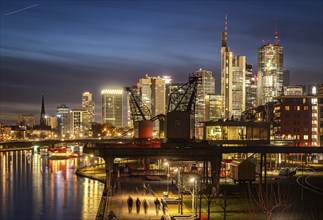 Skyline in the evening, skyscrapers of the banking district, historic harbour cranes at Weseler