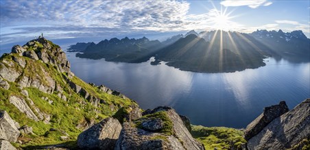 View of Fjord Raftsund and mountains in the evening light, sun star, view from the top of