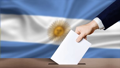 Argentina electoral elections concept. Hand holding ballot in voting ballot box with Argentina flag