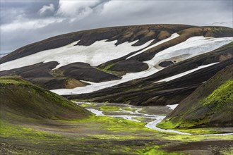 Colourful volcanic landscape with hills and snow, volcanic hot springs, Laugavegur trekking trail,