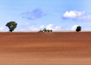 Tractor with plough in a field, Bad Frankenhausen, 13.08.2014., Bad Frankenhausen, Germany, Europe