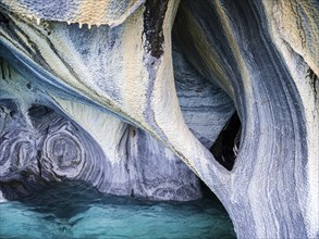 Inside the marble caves near Puerto Rio Tranquilo, small sightseeing boats explore single areas of