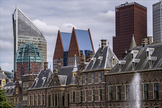 The historic Binnenhof, seat of the Dutch government, Hofvijver pond, skyline of the city centre at