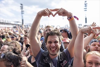 Adenau, Germany, 7 June 2024: Fans listen to the band Enter Shikari at Rock am Ring. The festival