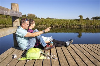 Hikers in the Steverauen Olfen, a renaturalised floodplain landscape and local recreation area in