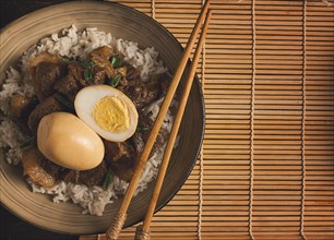 Stewed eggs, with pork belly, and rice, chinese food, homemade, selective focus, rustic, no people