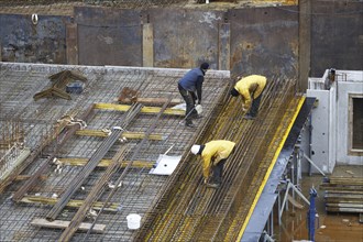 Construction site, reinforced concrete reinforcement bars, for a building ceiling, are installed