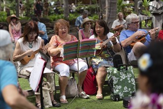 Local people singing and playing ukelele in a Waikiki event in Waikiki, Oahu, Hawaii, USA, North