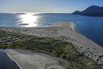 Aerial view of the peninsula at the mouth of the Rio Rodriguez, sandy beach partially covered by