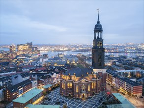 Aerial view of St. Michael's Church (Michel) at blue hour with harbour and Elbe Philharmonic Hall,