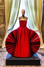 Silk-taffeta-sauvage evening dress with attached fans in various shades of red and pink, exhibition