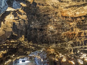 Interior view of a natural cave with impressive rock formations and subtle lighting, lanzarote,