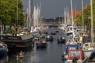 Christianshavns Kanal, round trip with electric hire boat, old district, at the same time very