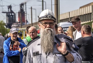 Steelworkers at a demonstration in front of the headquarters of ThyssenKrupp Steel Europe in