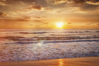 Beach holidays vacation background, peaceful serene morning sunrise on beach. Chennai, India, Asia