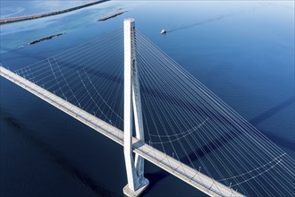 Aerial view of Helgeland bridge, connecting Sandnessjoen with the norwegian mainland, fishing boat