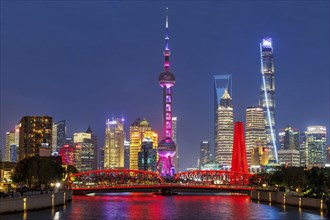 Shanghai skyline at the Bund with Oriental Pearl Tower city centre downtown at night in Shanghai,