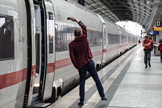 ICE train conductor shows signal for departure, Berlin, 21/09/2021