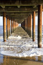 Rusty steel support pillars, Southwold pier, Southwold, Suffolk, England, United Kingdom, Europe