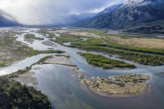 The widely branching arms of river Rio Ibanez, near Villa Cerro Castillo, aerial view, snow-capped