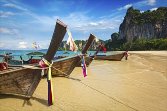 Long tail boats on tropical beach (Railay beach) in Thailand