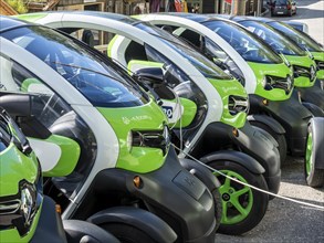 Electric powered Renault Twizy rental cars charging up at Geiranger, Norway, Europe