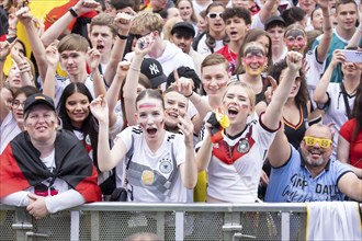 Football fans in the first rows of the fan zone at the Brandenburg Tor during the quarter-final