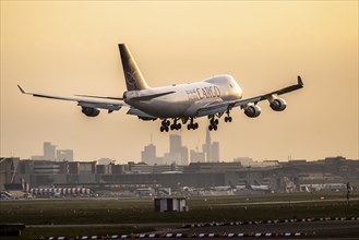 Aircraft shortly in front of landing at Fraport, dawn. Cargo aircraft of the airline Saudi Arabian