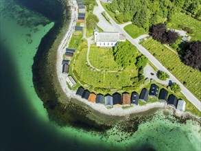 Aerial view of beach and church in Selje, wooden boat sheds, Stad, Vestland, Norway, Europe