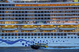 Cruise ship Aida Prima at the Cruise Terminal of Rotterdam, Kop van Zuid, skyscrapers at the