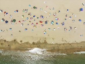 Beach life at the Atlantic Ocean near Punta Umbria. Aerial view. Drone shot. Huelva province,