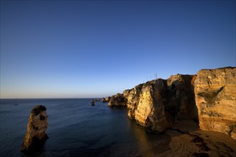 Colourful cliffs and rocks at sunrise on the beach, Praia da Dona Ana, Lagos, cliffs, Atlantic