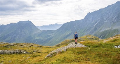 Mountaineer in front of mountain landscape, Carnic Main Ridge, Carnic High Trail, Carnic Alps,