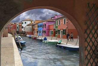 Colourful houses on the canal in Burano, Venice, Veneto, Italy, Europe