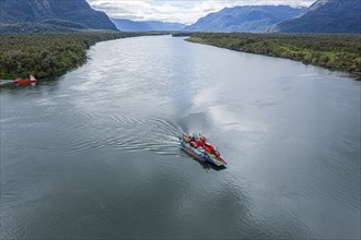 Aerial view of ferry crossing the river Rio Palena, connecting the road to Puerto Raul Marin