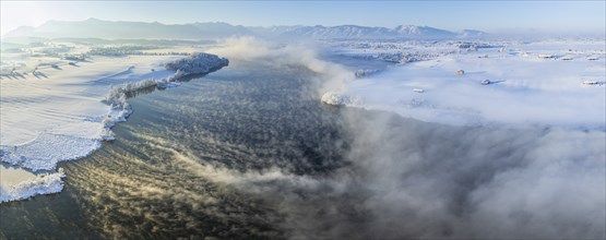 Aerial view of a lake in front of mountains, winter, snow, morning light, fog, panorama, Riegsee,