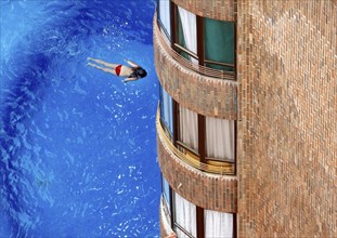 A girl swimming in the pool of a hotel, Benidorm, Spain, 26/08/2009, Europe